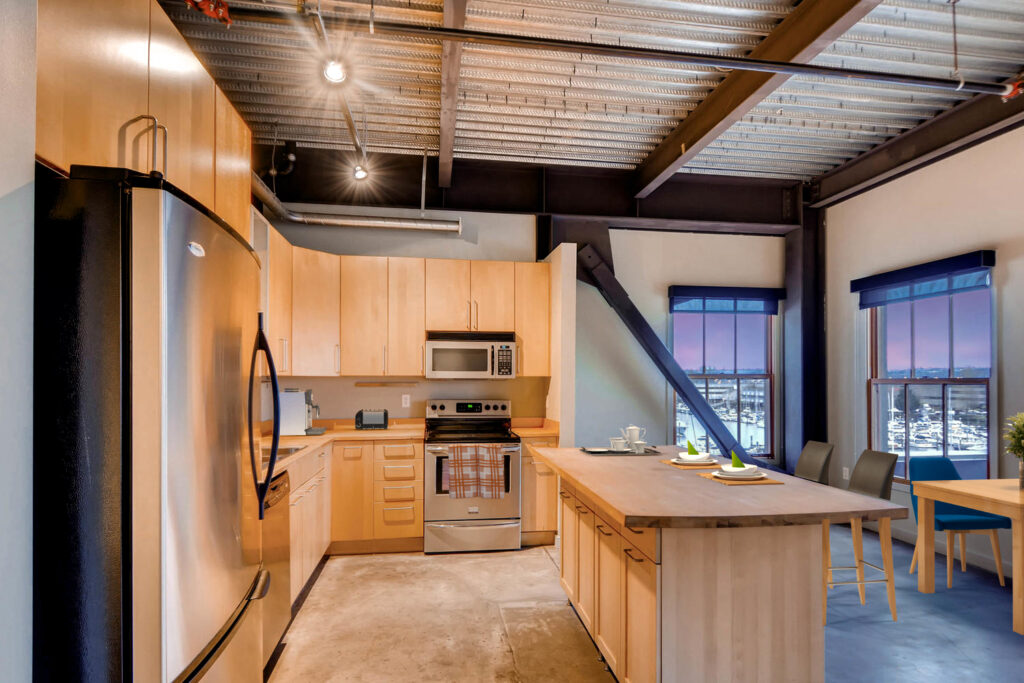 Modern kitchen with wood accents at Albers Mill Lofts, nice apartments in Tacoma, WA
