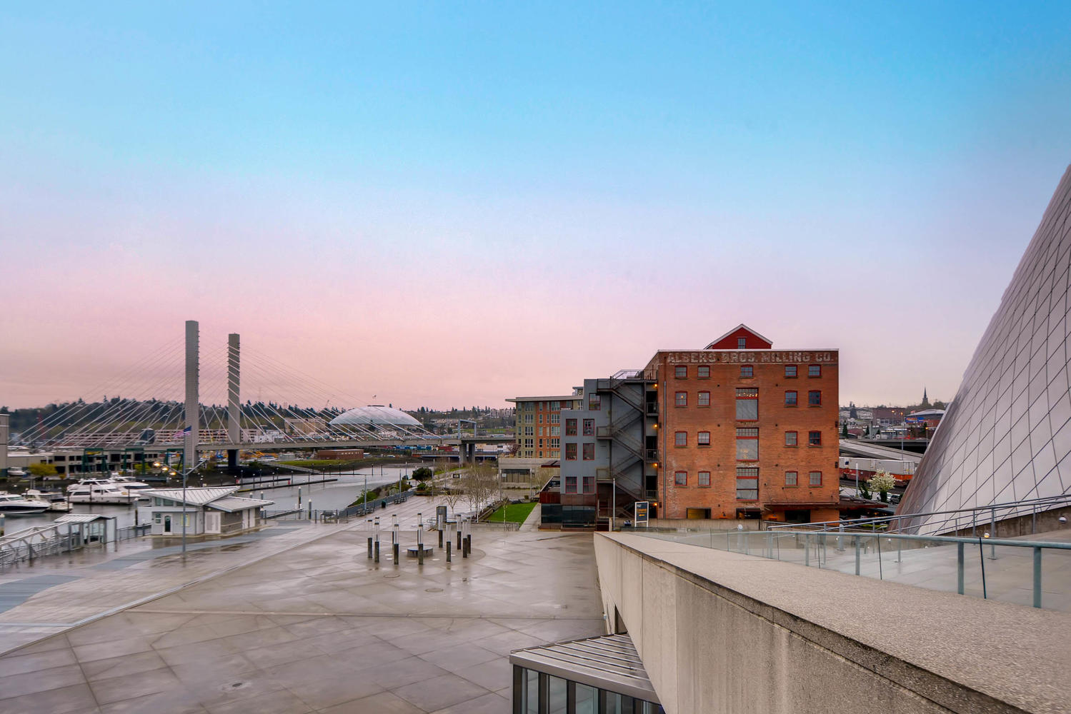 Paved boardwalk by the water, old buildings