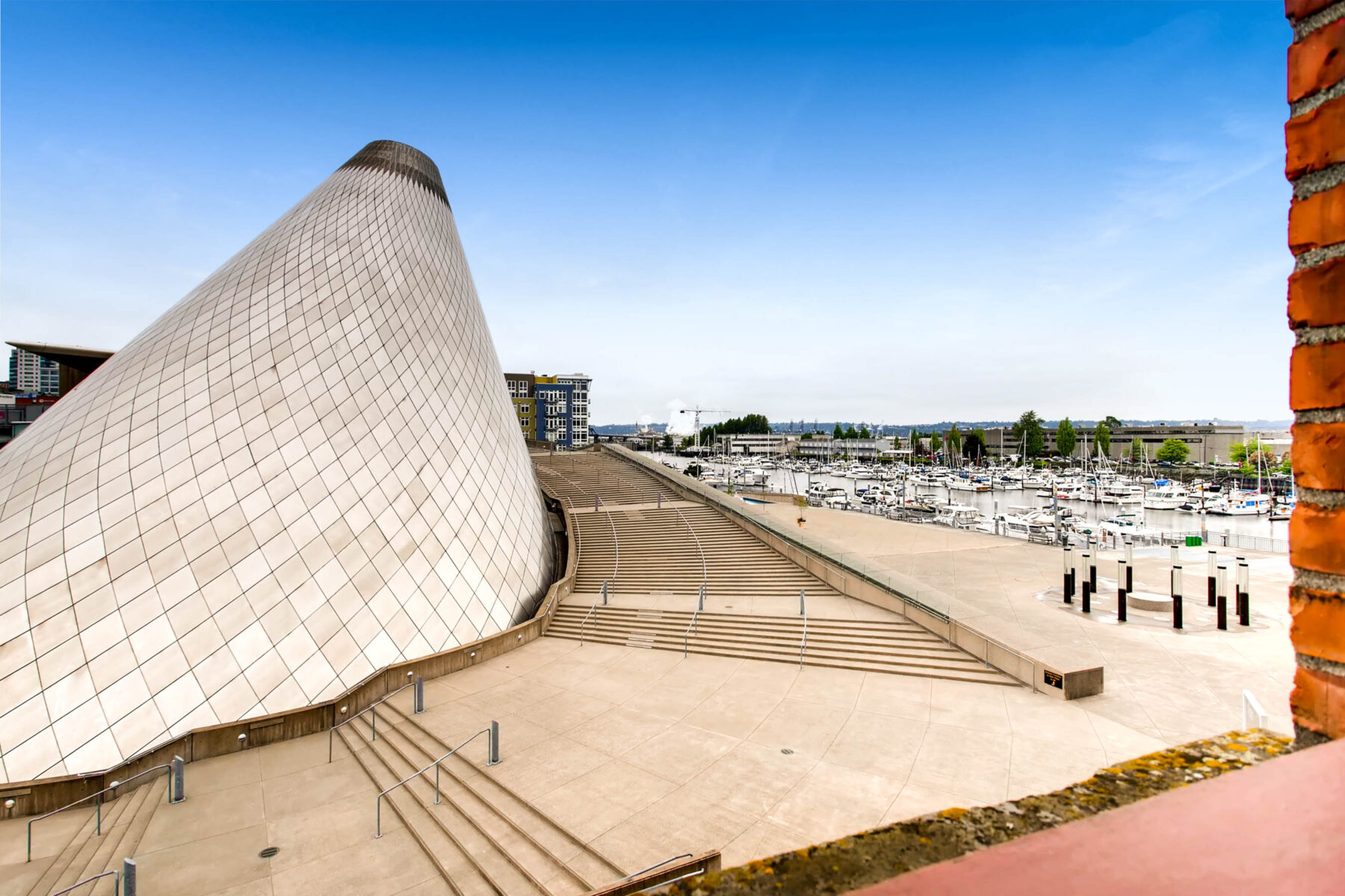 Large conical building with winding stairs wrapping around it